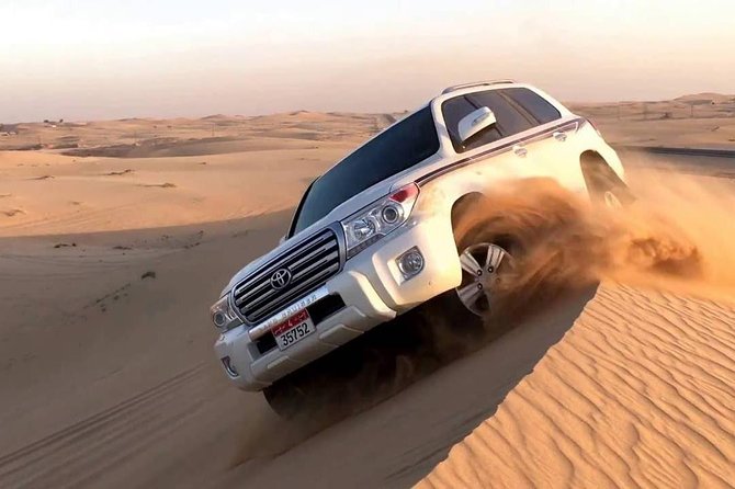 Dubai Red Dunes Desert Safari, With BBQ, Camel Ride, Sand Boarding And Much More - Belly dance, tanura, and fire performances