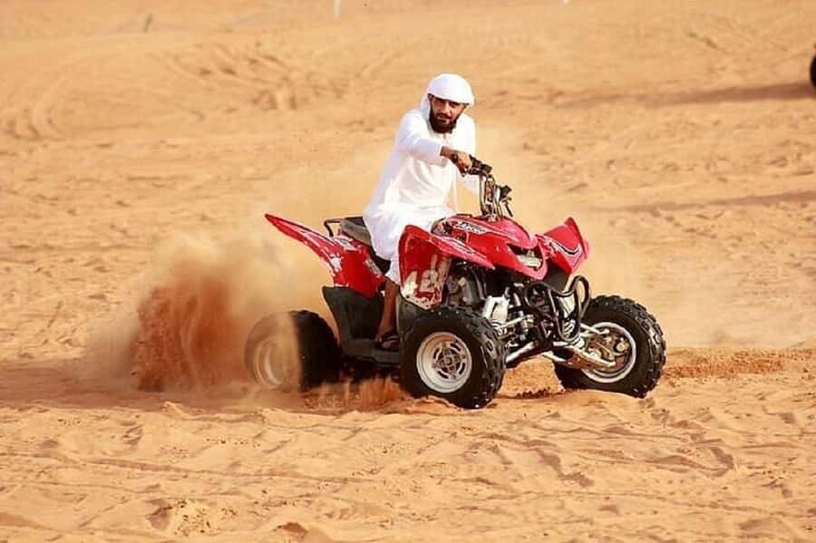 Dubai: Red Dunes Evening Quad Bike, Dune Blast with BBQ - Camel rides, falcon photographs, and Arabic hospitality