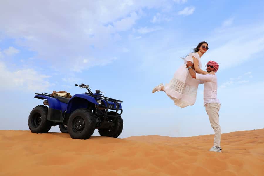 Dubai: Red Dunes Quad Bike with Sandboarding, Camels and BBQ - From Dubai to the red dunes of Lahbab