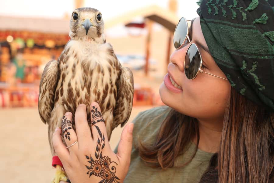 Dubai: Red Dunes Quad Bike with Sandboarding, Camels and BBQ - Fire, horses, camels, falcons and Yola dancing