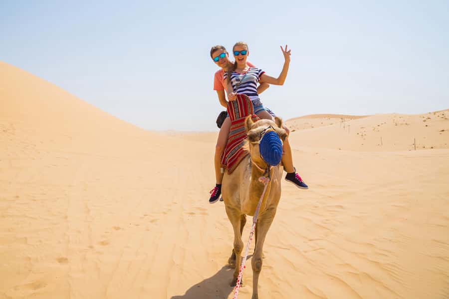 Dubai: Red Dunes Quad Bike with Sandboarding, Camels and BBQ - Quad biking across Lahbab’s red dunes