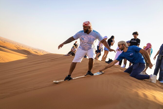 Dubai Red Dunes with Sandboarding, Camel Ride, Falcon & VIP Camp - From Dubai to the red dunes of Lahbab