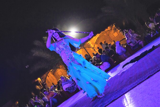 Dubai Red Dunes with Sandboarding, Camel Ride, Falcon & VIP Camp - Sandboarding across the soft sand