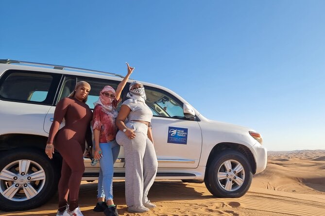 Dubai Red Dunes with Sandboarding, Camel Ride, Falcon & VIP Camp - A brief camel ride and the desert at twilight