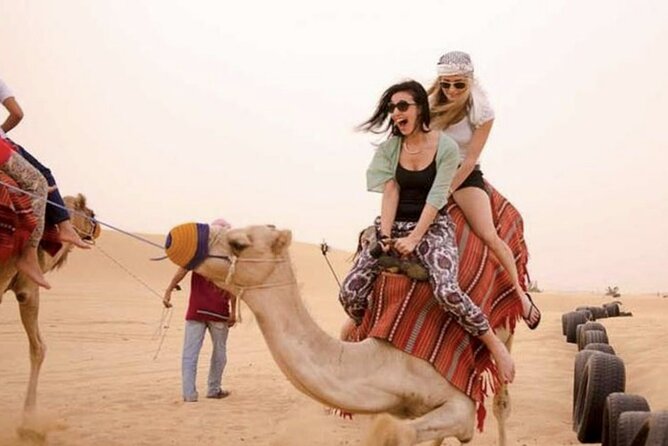 Dubai Royal Camel Race with Prime Seats & Short Camel Ride - The short camel ride and local costume photograph