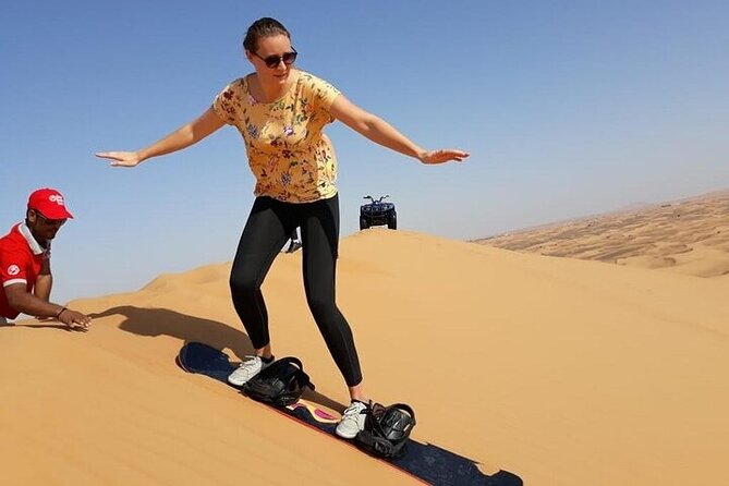 Dubai Self-drive Quad Bike, Sand Boarding, Camels & Refreshments - Quad biking across the red dunes