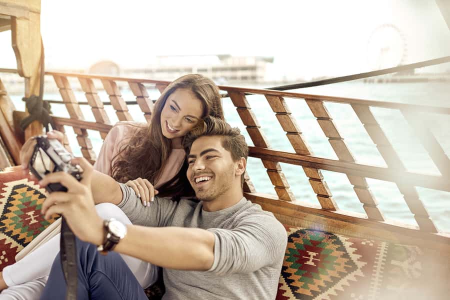 Dubai: Sunset Cruise on Traditional Boat & Emirati High Tea - Settling into a traditional wooden boat