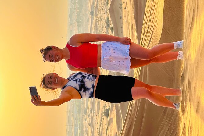 Dubai Sunset Red Dune Desert Safari, Sandboarding and Camel Ride - Sunset photos in the middle of the desert