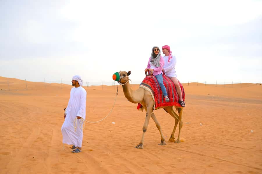 Dubai: Tour with BBQ Dinner, Camel Ride, & Traditional Show - Sunset photographs and the first desert activities