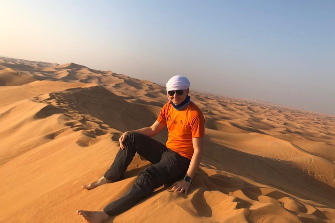Dubai: Unique MORNING Quad Bike Red Dunes Safari - Sandboarding above the desert
