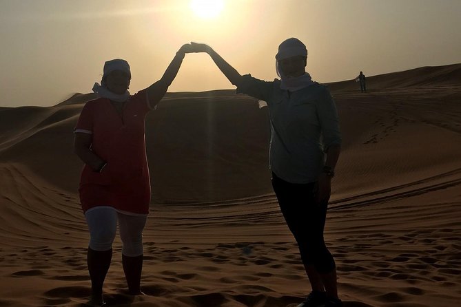 Dubai: Unique SUNSET 4WD Red Dunes Safari - Sandboarding adds a simple dose of adventure