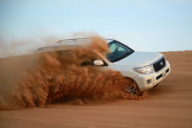 Evening Desert Safari Adventure in Dubai - Camel riding and sandboarding at camp