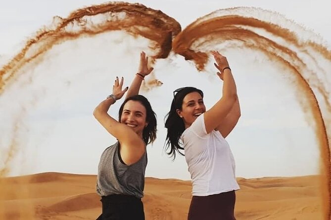 Evening Desert Safari & BBQ With Live Shows,Camel Ride,Falcon pic - Sandboarding and the high-dune photo stop
