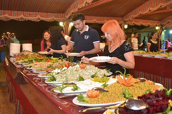 Evening Desert safari Dubai With Quad Bike Ride & BBQ dinner - Sunset among the dunes