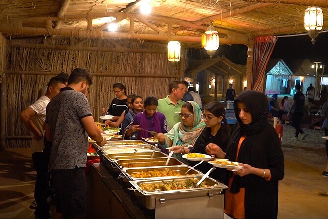 Evening Desert Safari Tour With Dinner & Entertainment - Camel rides, sandboarding, and henna at camp