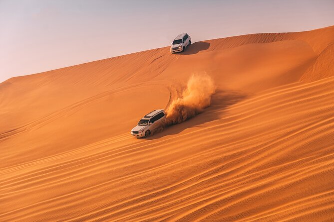 Evening Desert Safari with ATV Quad Bike Dune Bashing BBQ Dinner - ATV riding across the golden sand