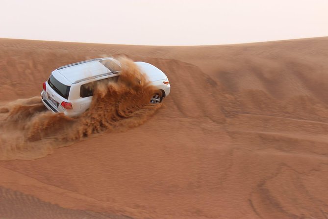 Evening Desert Safari with BBQ Dinner - Red dunes, fast turns, and a sunset stop