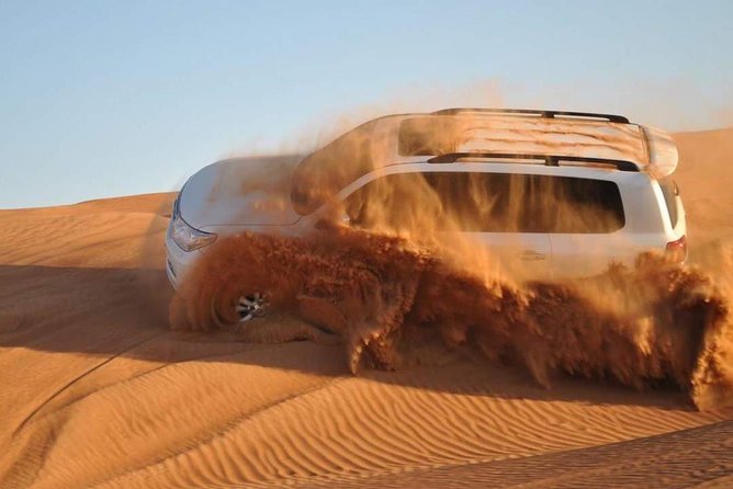 Evening Desert Safari with Camel Ride, BBQ Dinner and Dune Bashing - Camel riding and the camp welcome