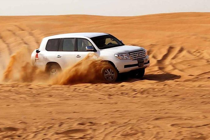 Evening Desert Safari with, Dune Bashing, Camel Ride, sand board - Camel riding gives you the traditional postcard moment