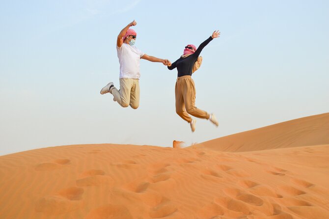 Evening Desert Safari with Quad Bike, BBQ Dinner and Camel Ride - Sandboarding and desert photos