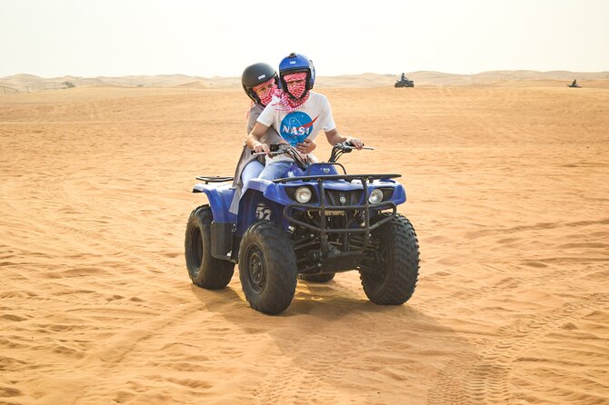 Evening Desert Safari with Quad Bike, BBQ Dinner and Camel Ride - Camel riding at the traditional camp