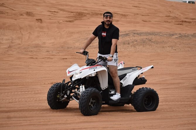 Evening Desert Safari with Quad Bike, Camel Ride & BBQ Dinner - Sandboarding, falcons, henna, and Arabian clothing