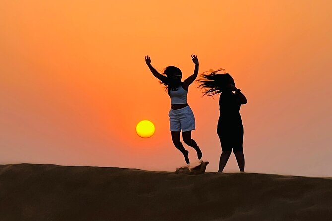 Evening Dubai Desert Safari, Red Sand, Premium camp shows & Diner - Sandboarding and camel riding add variety