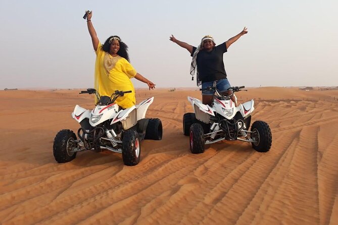 Evening Red Dunes Safari with Quad Biking, BBQ Dinner & LiveShows - Quad biking across the designated red-dune area