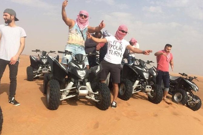 Evening Red Dunes Safari with Quad Biking, BBQ Dinner & LiveShows - Sandboarding and the sunset pause