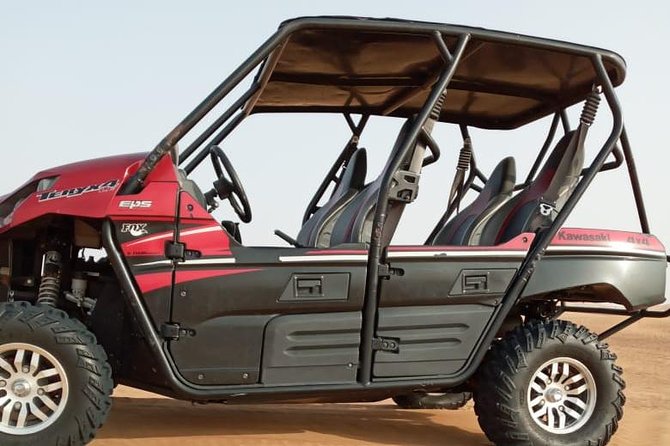 Evening Safari with Quad Bike, Camel Riding, BBQ Dinner and Dune Bashing - Quad biking across the sand