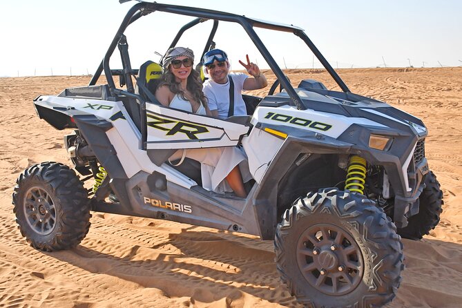 Experience Dubai Best Red Dune Evening Desert Safari BBQ Dinner - Sand-boarding and sunset pictures