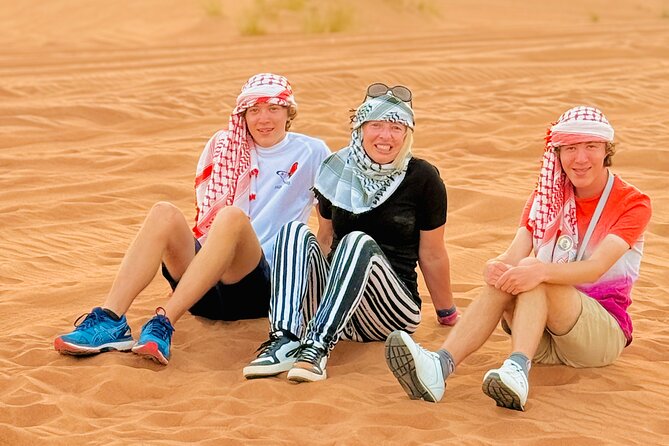 Experience Red Dune Safari Shows, Camels, BBQ & ATV Bike in Dubai - Belly dance, fire, and Tanoura after dark