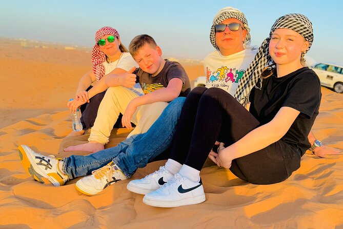 Experience Red Dune Safari Shows, Camels, BBQ & ATV Bike in Dubai - Red dunes, sunset photos, and sandboarding