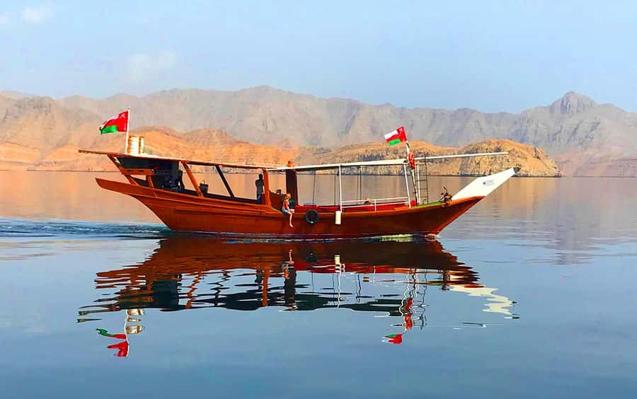 From Ras al Khaimah: Musandam Khasab Day Trip with Transfer - Boarding the wooden dhow in Khasab