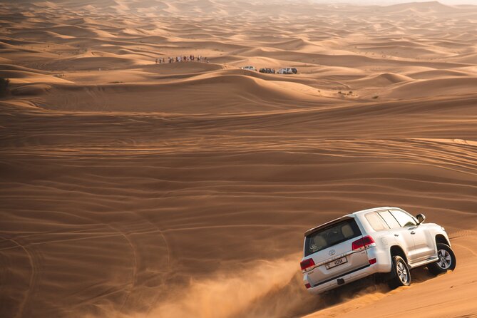 Full Day Safari Grand Adventures with Dune Bash on 4X4 in Dubai - Sandboarding, photos, and a short camel ride