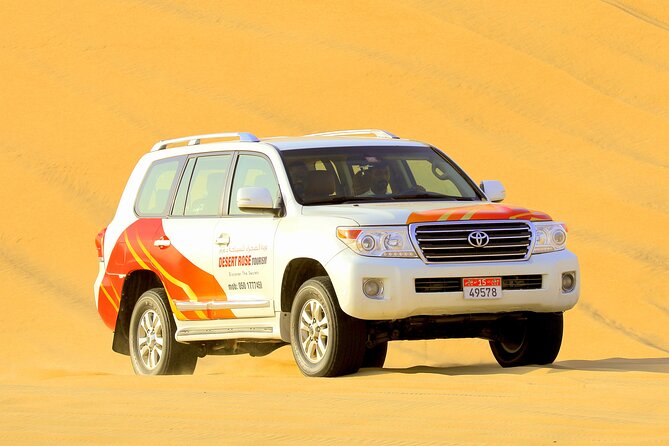 Half-Day Desert Safari from Abu Dhabi - Sandboarding across the soft dunes