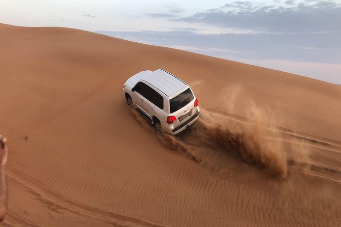 Half-Day Evening Desert Safari in Dubai with BBQ Dinner - Leaving Dubai for the red dunes