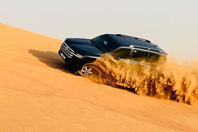 Morning Desert Safari, Quad Bike, Dunes Bashing and Camel Ride - Sandboarding Down the Dunes