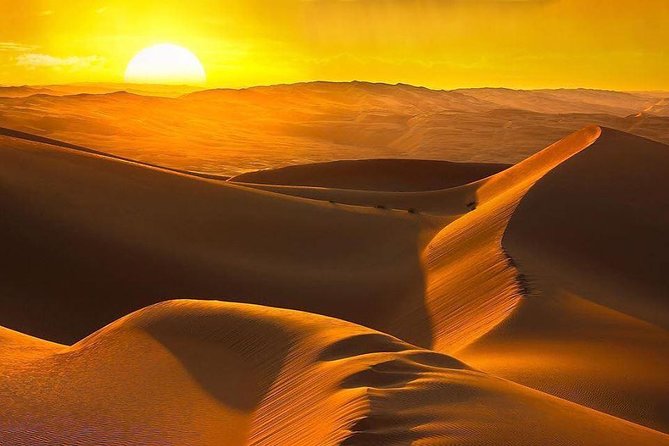 Morning Desert Safari with Camel Ride & Sand Skiing Private Tours - Sunrise from a high dune