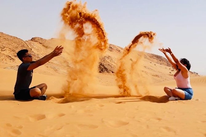Morning Red Dunes with Camel Ride, Sandboarding and Refreshments - Camel rides, falcons, and the camp stop