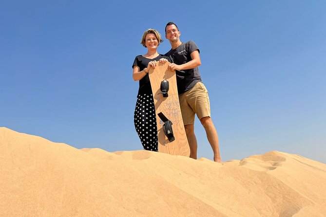 Private Abu Dhabi Sunset Desert Safari with Sand Boarding - A camel farm with a practical cultural angle