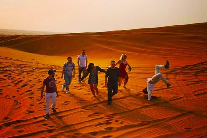 Private Desert Safari Red Dune with BBQ, Sand Boarding and Camel Ride - Sunset photography above the sand