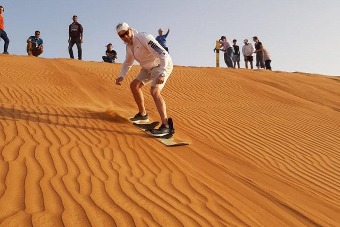 Private Desert Safari Red Dune with BBQ, Sand Boarding and Camel Ride - Tanoura, belly dancing, and the fire show