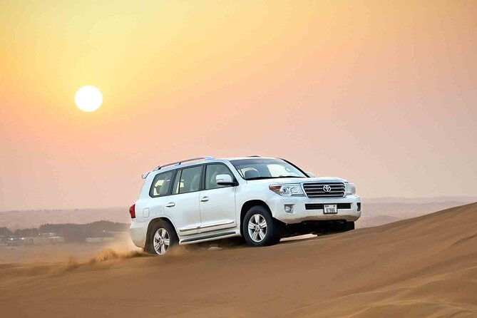 Private Evening Desert Safari Dubai with Camel Riding & BBQ - Sunset photos and sandboarding break up the drive