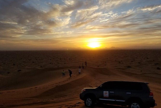 Private Evening Red Sand Desert Safari with BBQ Dinner - Sunset from a high red dune
