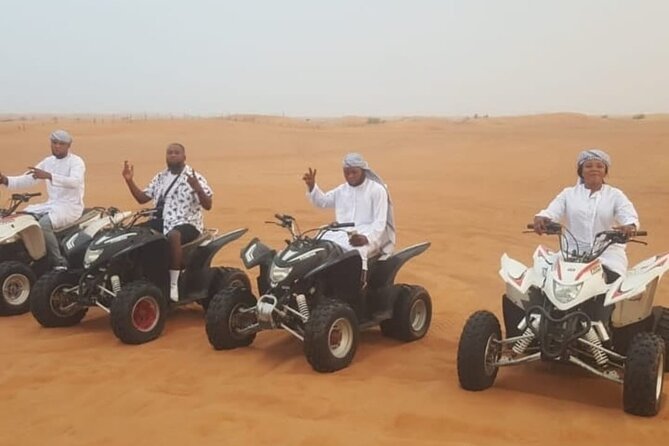 Quad Bike Dubai Desert Safari with BBQ Dinner Sandboard and Show - Quad biking and dune bashing at Lahbab