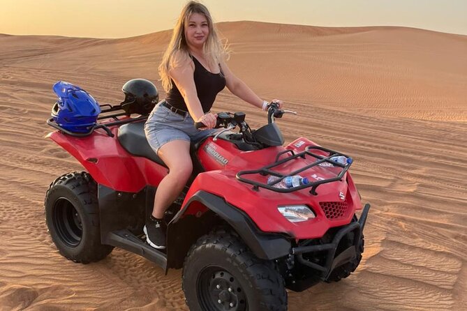 QUAD BIKE self Drive with Desert safari Full Program - Red dunes, sharp turns, and a sunset at Al Madam