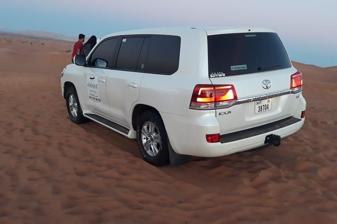 Red Dune Desert Safari & Quad Bike, BBQ Dinner. Camel Ride, Sandboarding - Hotel pickup in an air-conditioned Land Cruiser