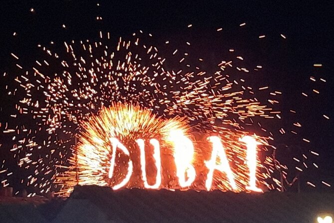 Red Dunes Desert Safari Dubai with Dinner Buffet, Show & Transfer - Sunset photos, sand boarding, and a short camel ride