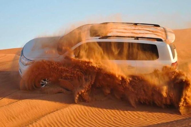 Red Dunes Desert Safari, Sand Board, Camel Ride with BBQ Dinner - Leaving Dubai for the red sands of Lehbab